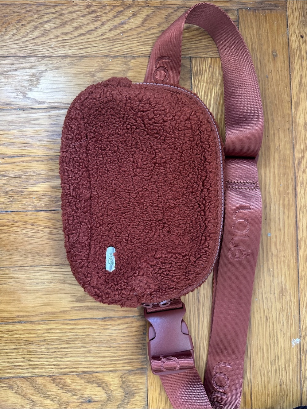 Lole women’s Deep Rust Sherpa Sling Belt Bag